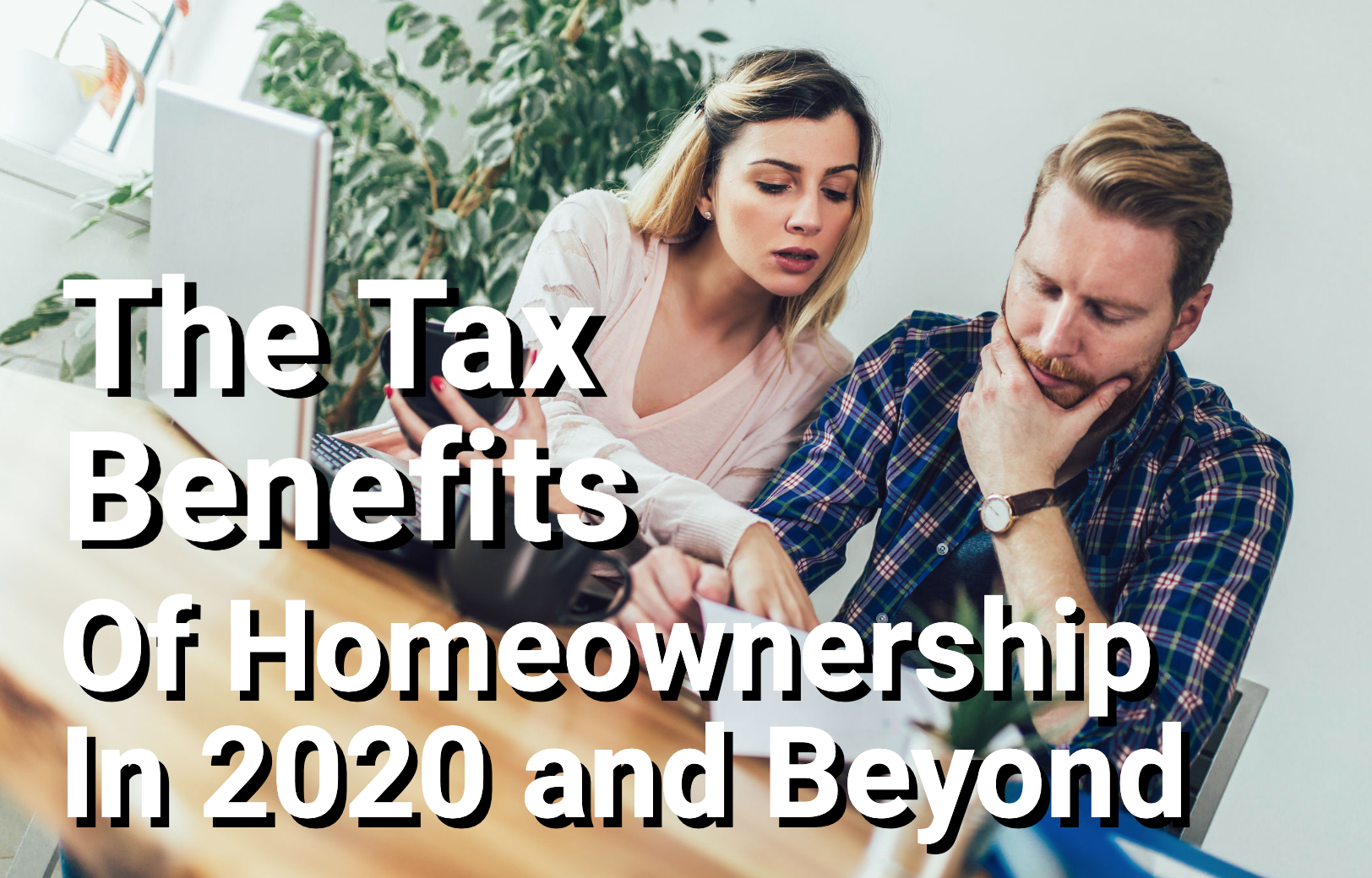 Couple doing taxes at home table